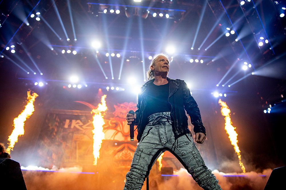 Bruce Dickinson performing live with Iron Maiden amid stage flames